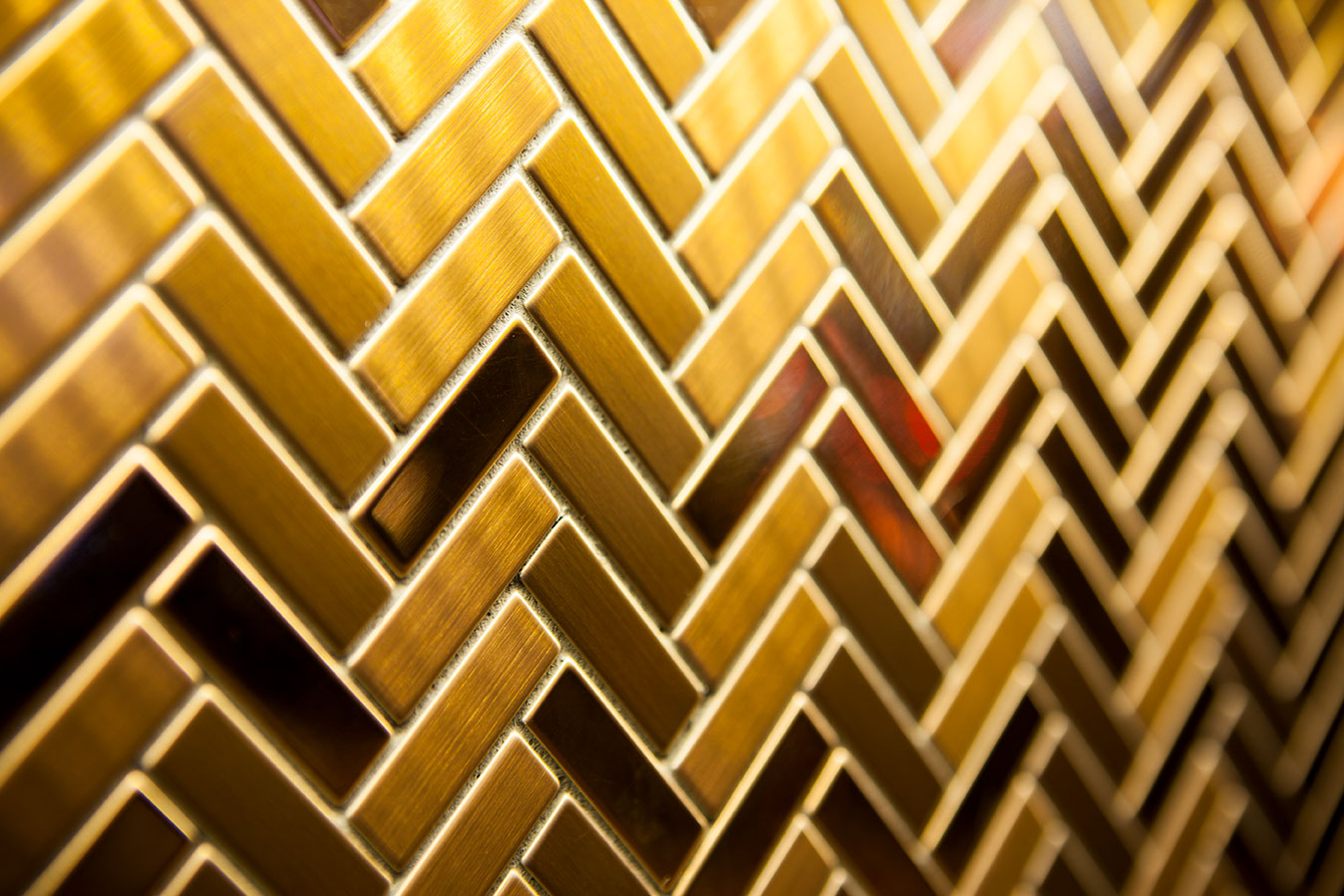 Herringbone titanium gold tile